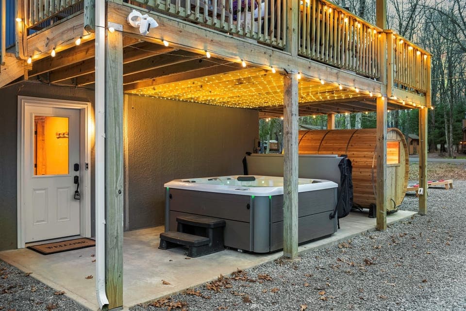 Outdoor Oasis: Unwind in the hot tub beneath sparkling lights, surrounded by nature's beauty!