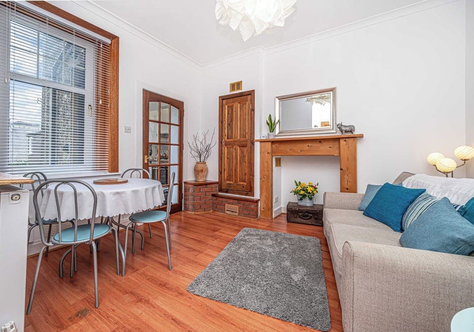 Relax in our cosy living room and dining area