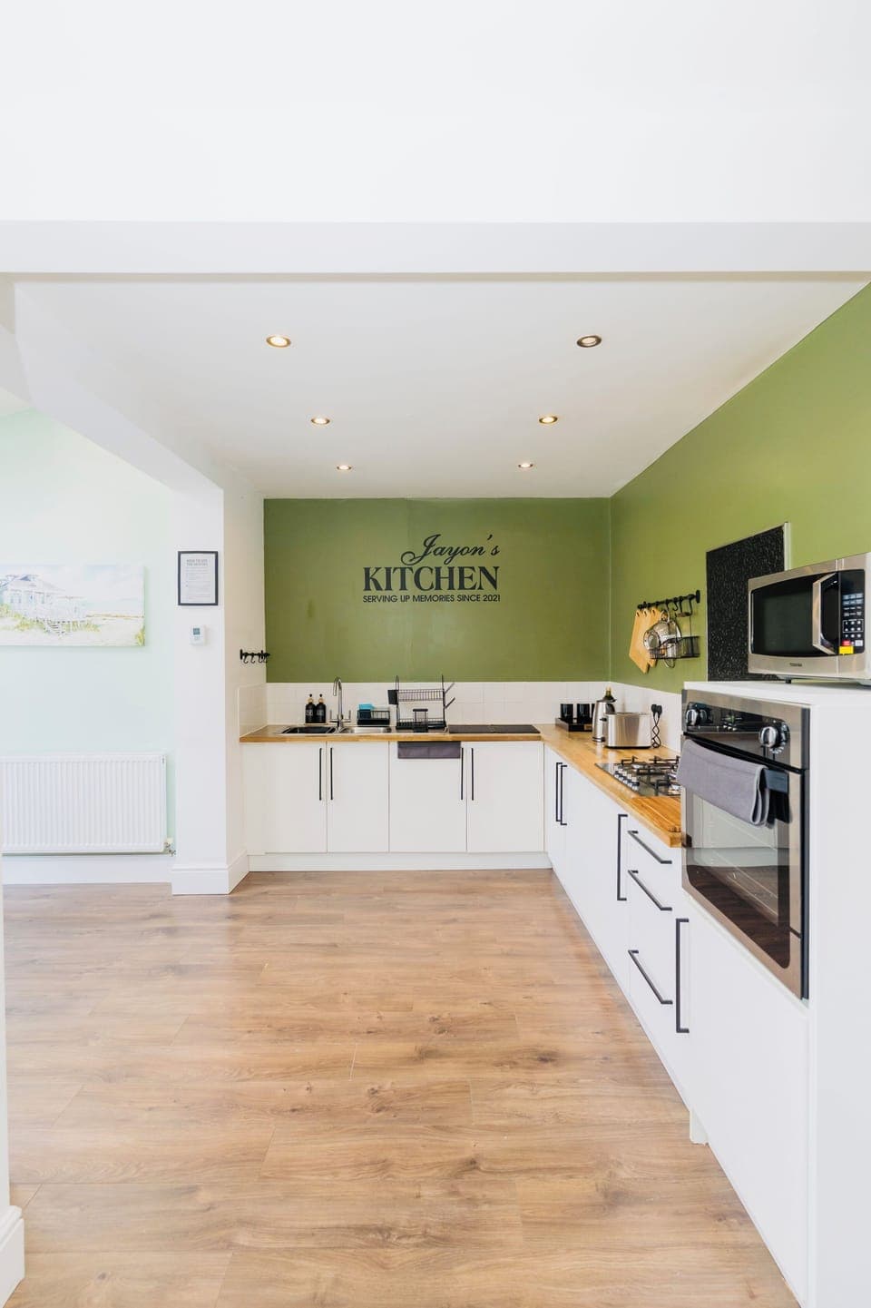 Tea towels, dishes drying rack, dishes - Microwave and oven.