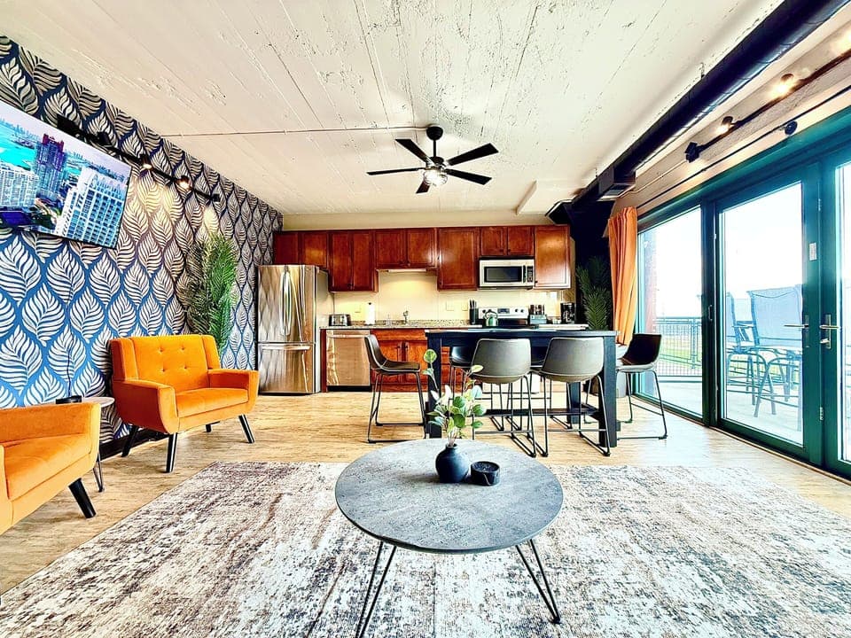 Open Living & Kitchen Space
Enjoy a bright, open layout with a full kitchen, cozy seating, and sliding doors leading to a private patio with lake views.