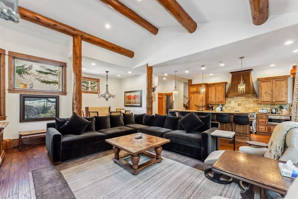 Living room: Main floor, wood-burning fireplace, Smart TV, Sonos speaker, deck access