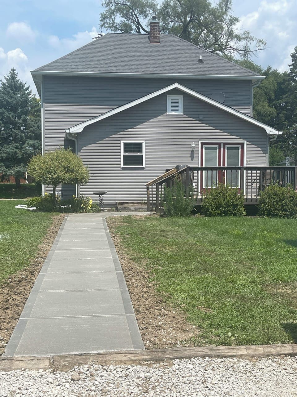 New sidewalk from 3-4 parking spaces in rear