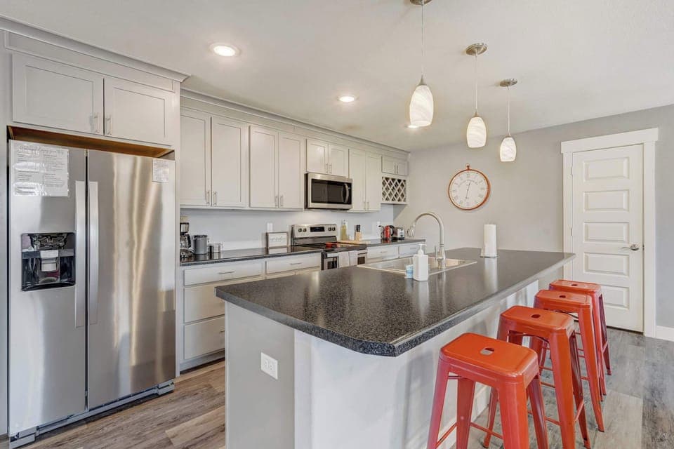 Welcome to a bright and welcoming living space featuring cozy seating, a Smart TV, and mountain views through sunlit windows








