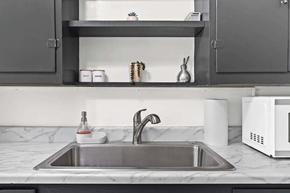 Kitchen: Unit 1 - Cook with ease in this functional kitchen featuring updated appliances and essentials.