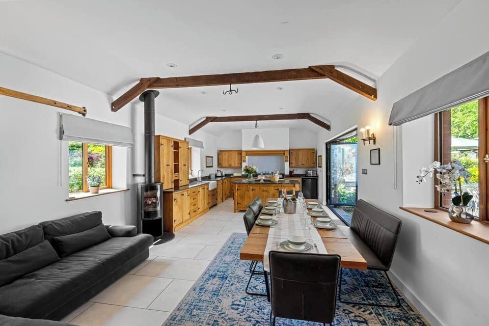 Fully equipped luxury kitchen. Large table that comfortable seats 12. Modern fireplace, island 360 garden views. Bifold doors that open onto your private courtyard area. Large sofa to make the kitchen a beautiful social area. 