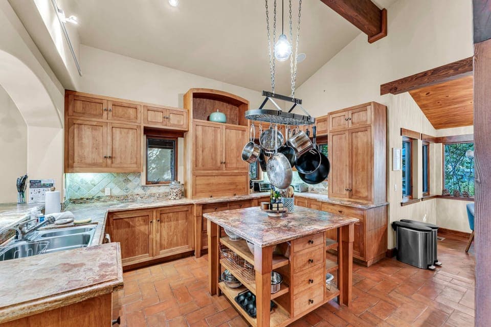 Kitchen: Main floor, drip coffee maker, toaster, blender, cooking utensils, tableware