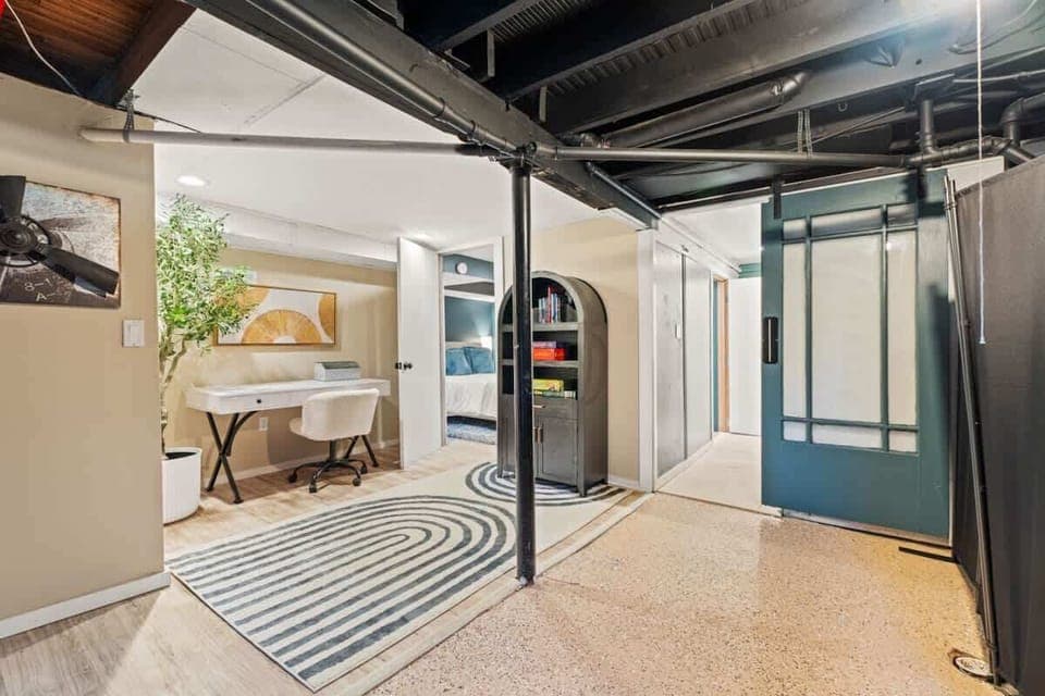 Extra space for work or play  cozy desk, bookshelf, and room to relax.