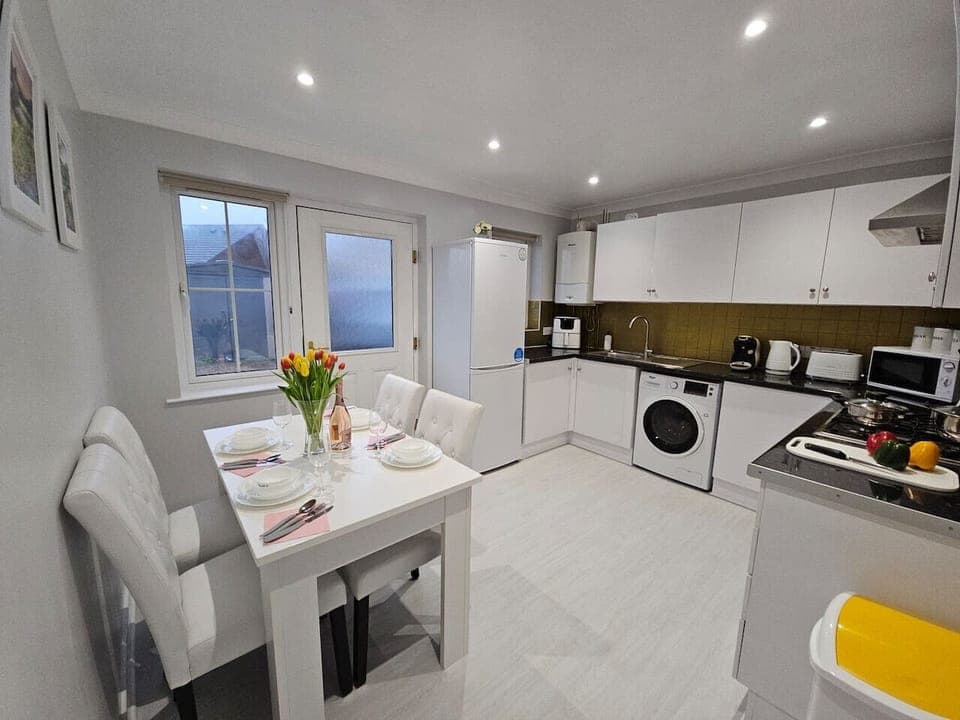 Modern kitchen with dining space for four