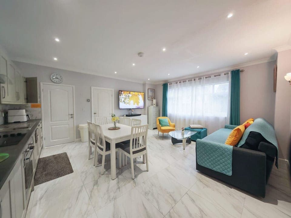 Spacious open-plan room combining kitchen, dining and lounge areas.