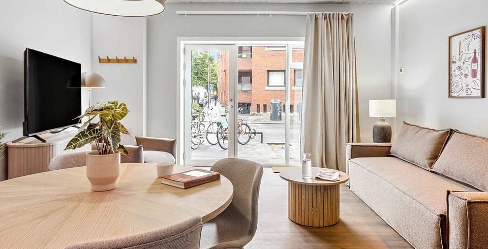 Room view with natural light and both blackout curtains and a thin layer of curtains, to ensure your privacy