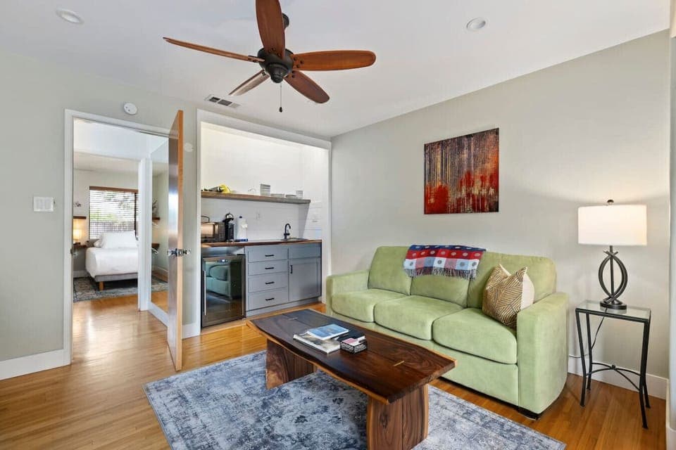 Spacious open-concept living area with hardwood floors