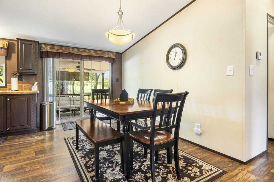 Dine in style! Enjoy meals at this inviting table, with easy access to the kitchen and outdoor patio.