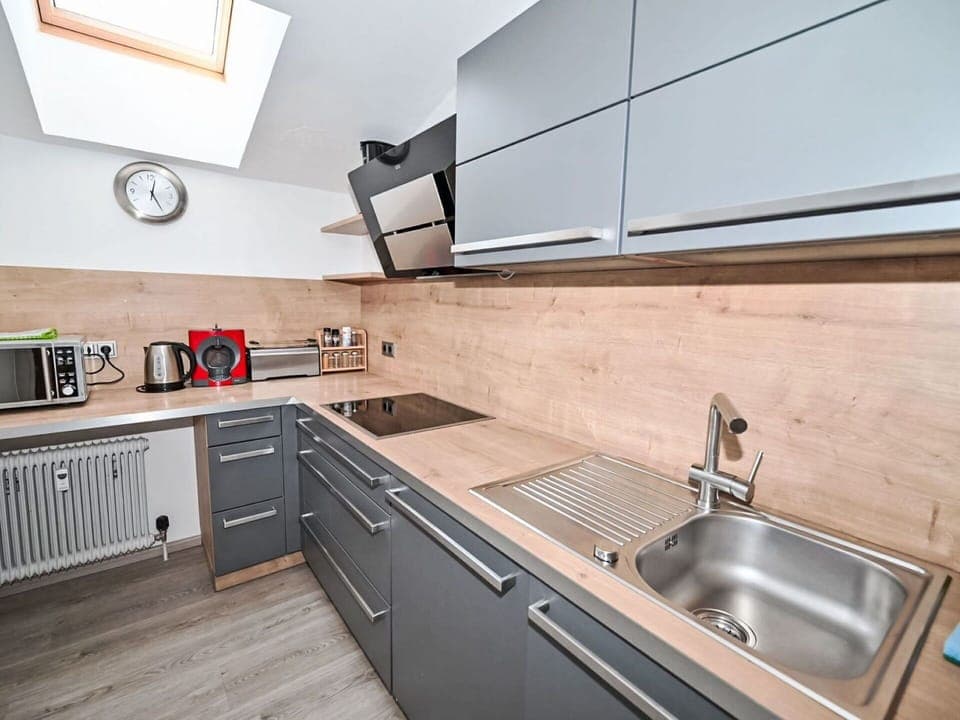 Kitchen, Countertop, Kitchen Appliance, Major Appliance, Kitchen Sink, Cabinetry, Flooring, Kitchen Stove, Home Appliance, Sink