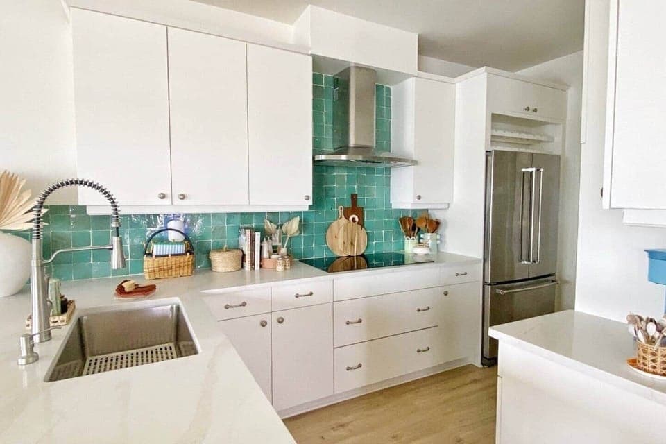 Beautiful newly renovated kitchen, with induction cooktop, refrigerator with filter water, dishwasher, coffee station and laundry room through the kitchen with additional cleaning supplies and cooler to take to the beach. 
