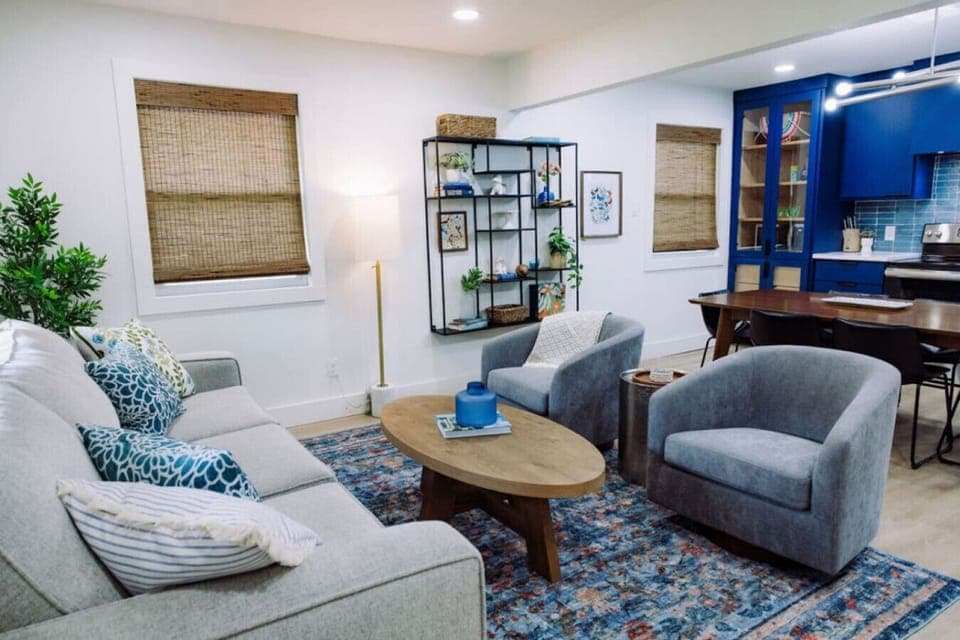 {Living room ~ Home #2} Open-concept area w/ sleeper sofa (Queen bed) and smart TV