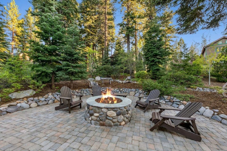 Beautifully landscaped backyard area with built in gas fire pit and private hot tub!