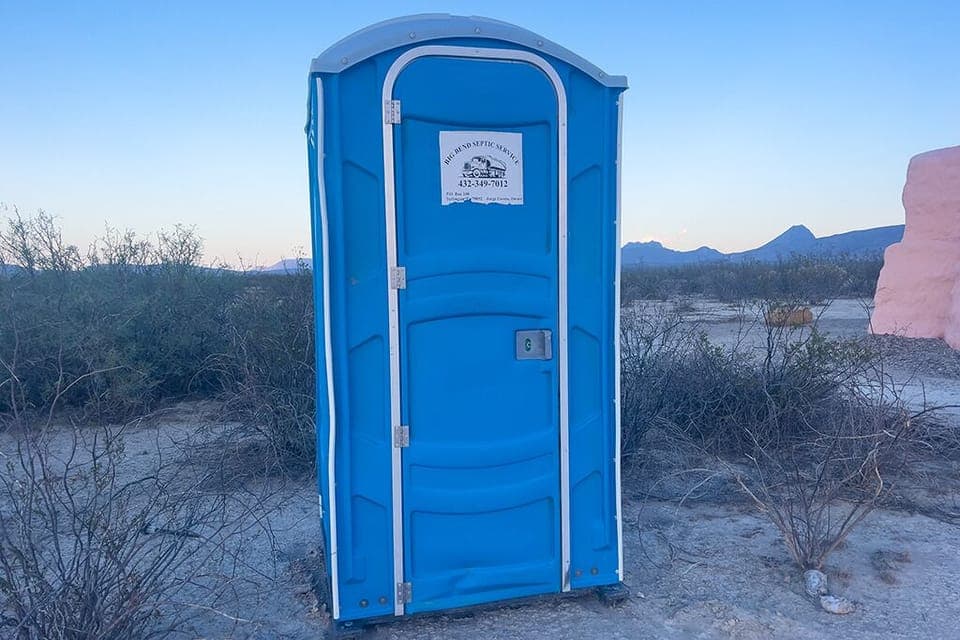A well-kept porta potty is closest to Domo Sol, but is just steps from both.
