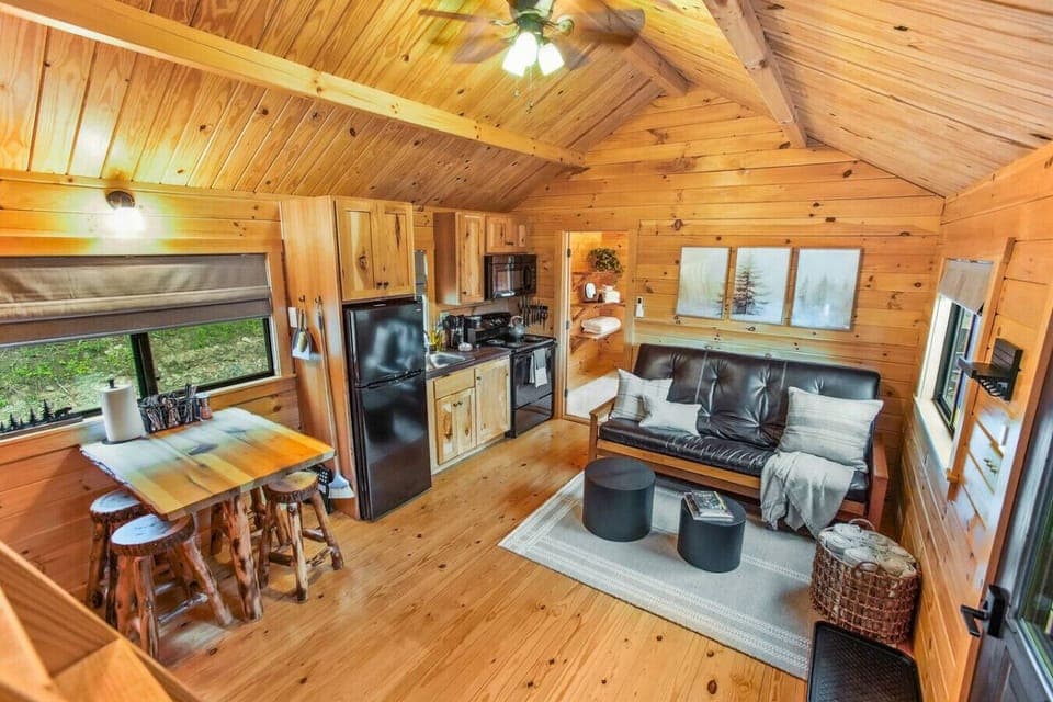 Open living with beautiful wood walls/ceiling.