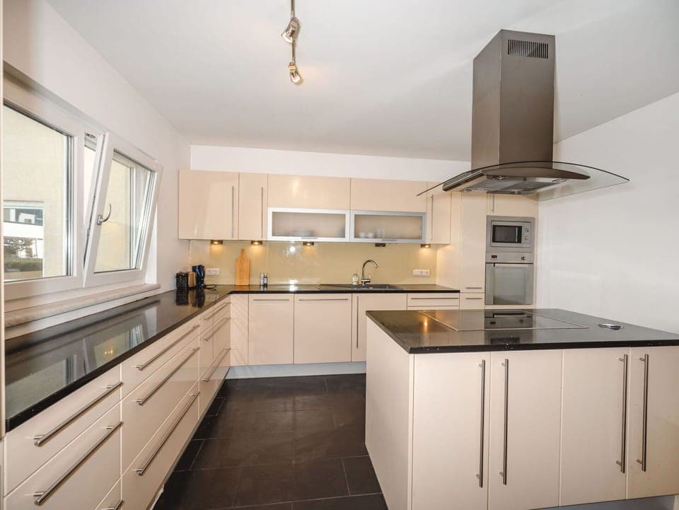 Kitchen, Countertop, Flooring, Cabinetry, Kitchen Appliance, Wood, Interior Design, Furniture, Floor, Light Fixture