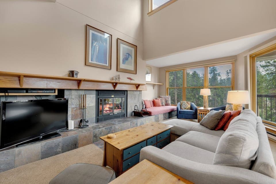 Cozy living space with fireplace and tv