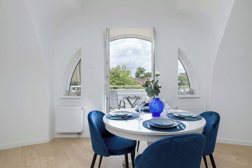 Enjoy your favorite shows on the flat-screen television in the elegant living area.