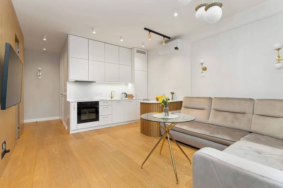 The modern kitchen, which flows seamlessly into the cosy living room, creates the perfect place for cooking and relaxing.