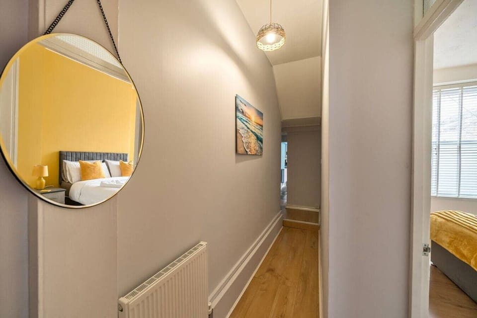 Hallway with decorative touches and mirror reflection