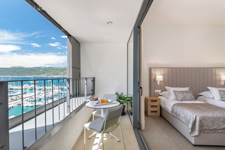 Deluxe Double or Twin Room, Balcony, Sea View | Minibar, in-room safe, desk, blackout drapes