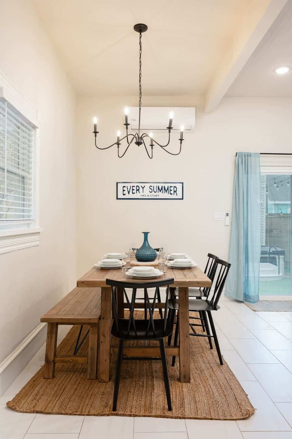 Front House Dining Area: Share delicious meals at this charming table, perfect for family gatherings and laughter!