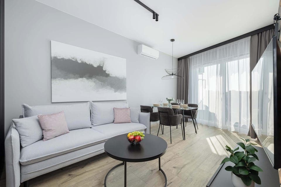 Living room with a comfortable sofa and TV. 