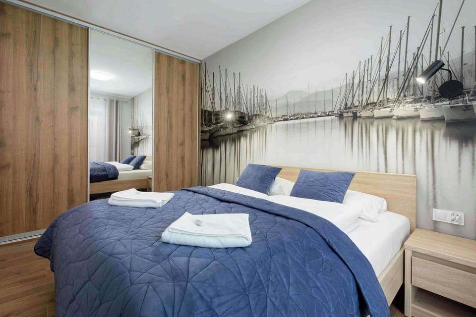 The bedroom's modern design ensures a comfortable stay. 