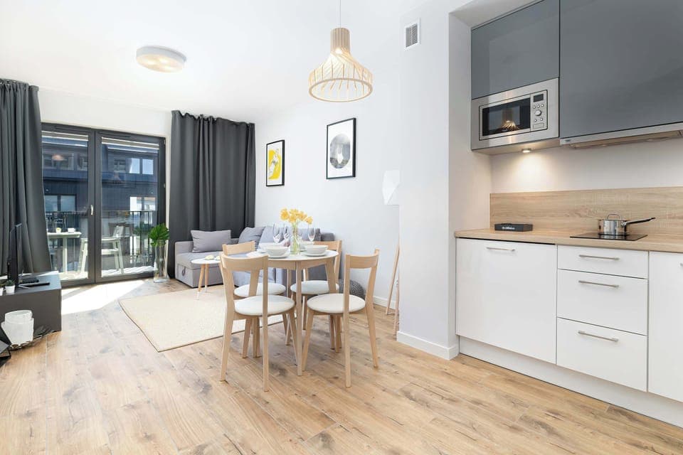 Bright space of the living area combined with a kitchenette. The whole is cozy and functional.