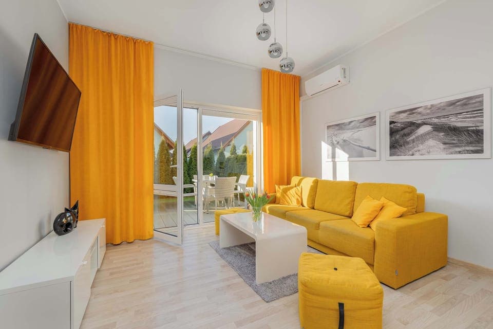 Living room with a comfortable sofa and TV. 