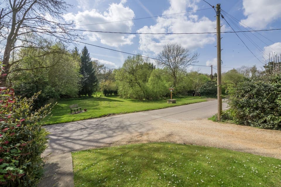 The entrance driveway leading to the parking area at the back of the cottage