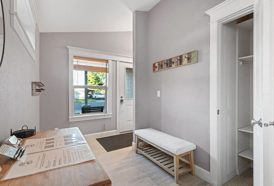 Entrance to the home with a space for taking off shoes and hanging coats