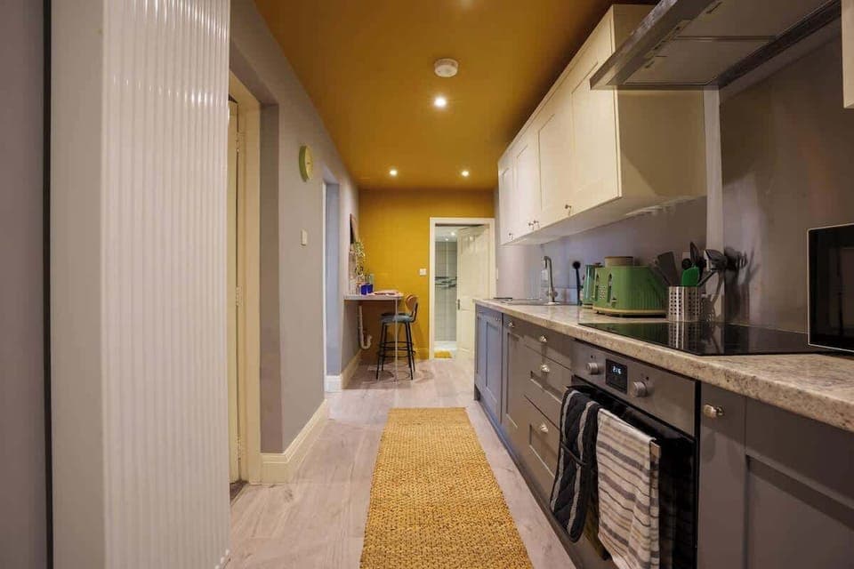 A full kitchen includes all the essential appliances and fixtures needed for cooking, preparing, and storing food.