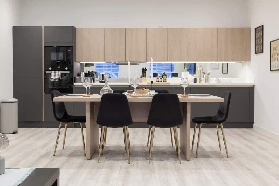 The dining area is a designated space for meals, typically featuring a table and seating.