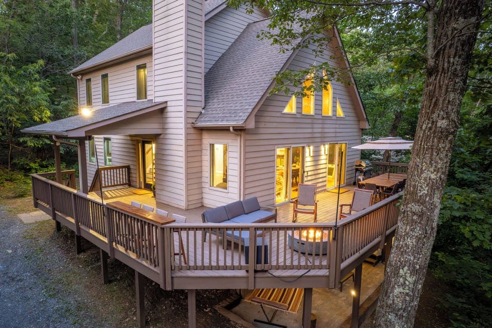 Wraparound deck: bar top, cozy firepit, & BBQ grill - al fresco dining for 12.
