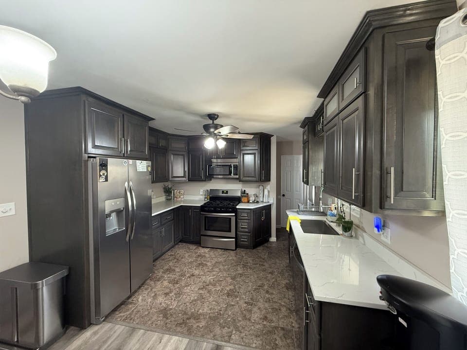 Newer kitchen with custom cabinets and new dishwasher in 2025