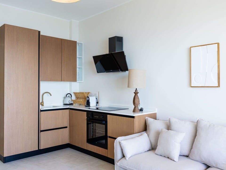 Furniture, Interior Design, Wood, Flooring, Floor, Room, Cabinetry, Lighting, Countertop, Kitchen