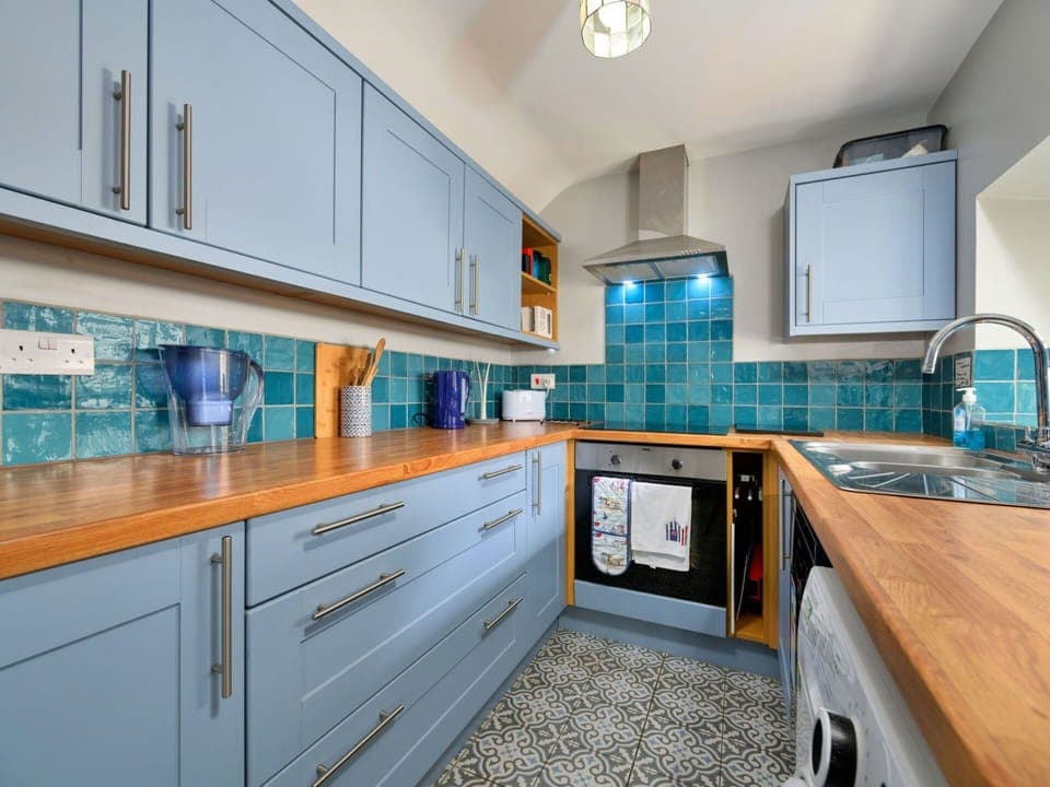 Kitchen, Countertop, Kitchen Appliance, Major Appliance, Flooring, Interior Design, Cabinetry, Wood, Floor, Kitchen Stove