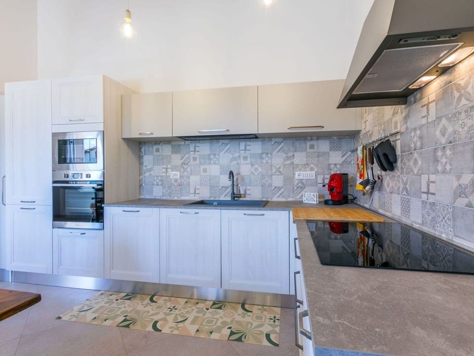 Kitchen, Kitchen Appliance, Countertop, Major Appliance, Flooring, Cabinetry, Floor, Interior Design, Wood, Kitchen Stove