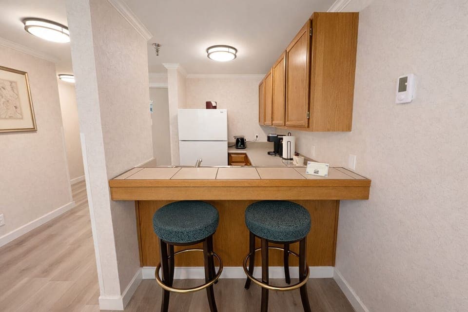 Suite, 2 Queen Beds | Private kitchenette | Full-size fridge, microwave, cookware/dishes/utensils, freezer