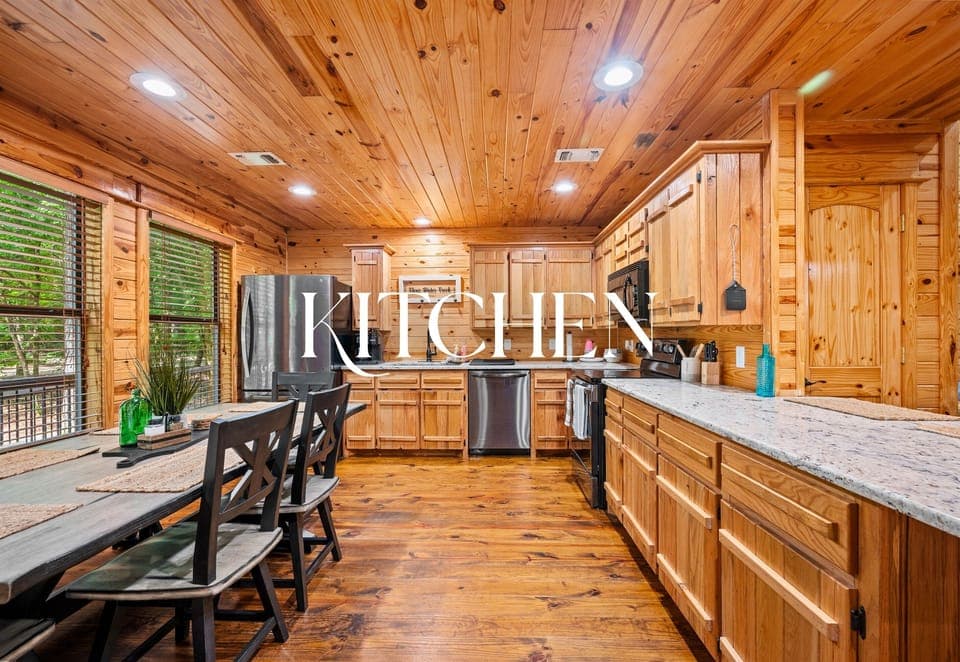 Rustic-style kitchen with granite countertops, full appliances, and a dining area for home-cooked meals with family or friends.