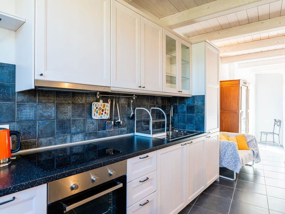 Kitchen, Countertop, Kitchen Appliance, Major Appliance, Cabinetry, Flooring, Interior Design, Kitchen Sink, Sink, Plumbing Fixture