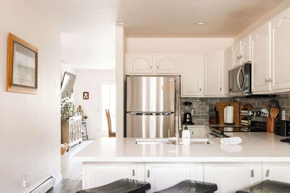 Open kitchen with bar-style seating at the kitchen counter