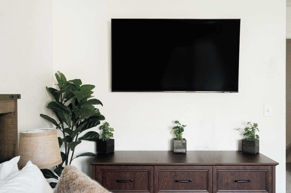 Primary bedroom with smart TV plus a full, private ensuite bathroom