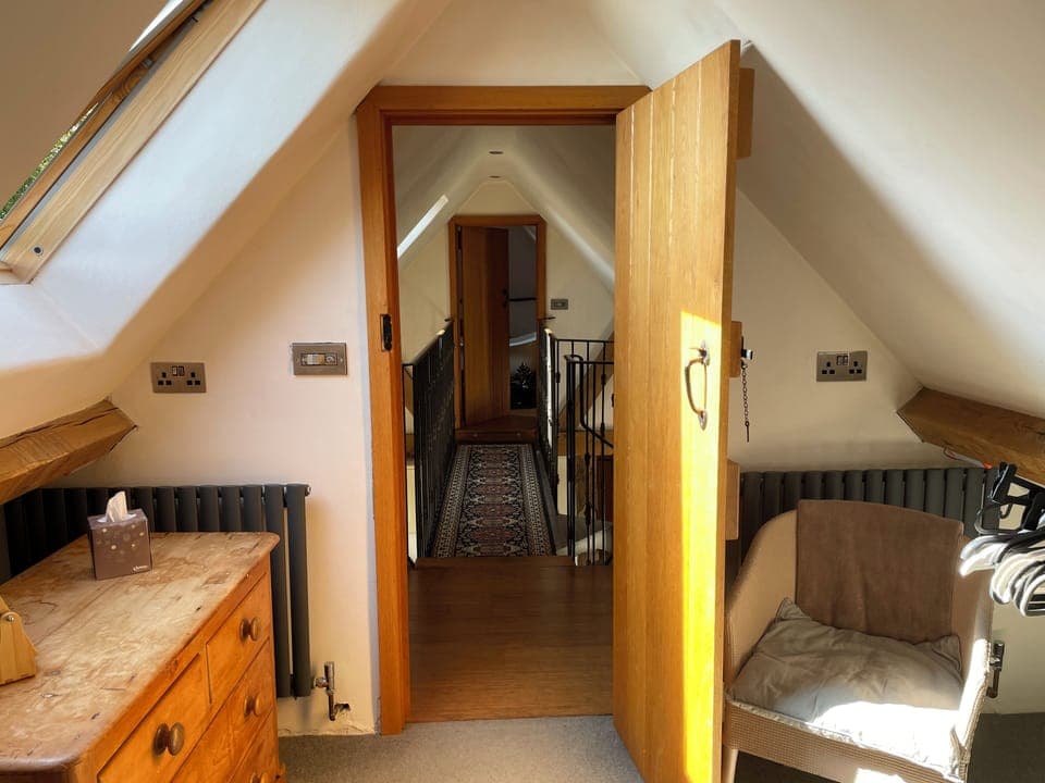 View from upstairs bedroom across bridge to bathroom