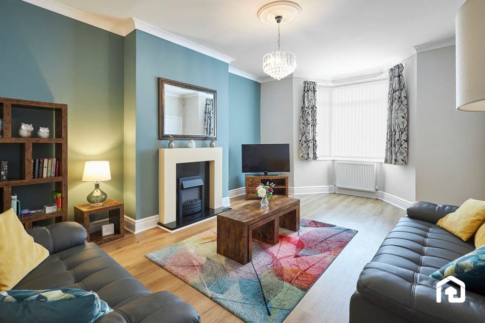 Relax in this spacious living room designed for comfort and style.