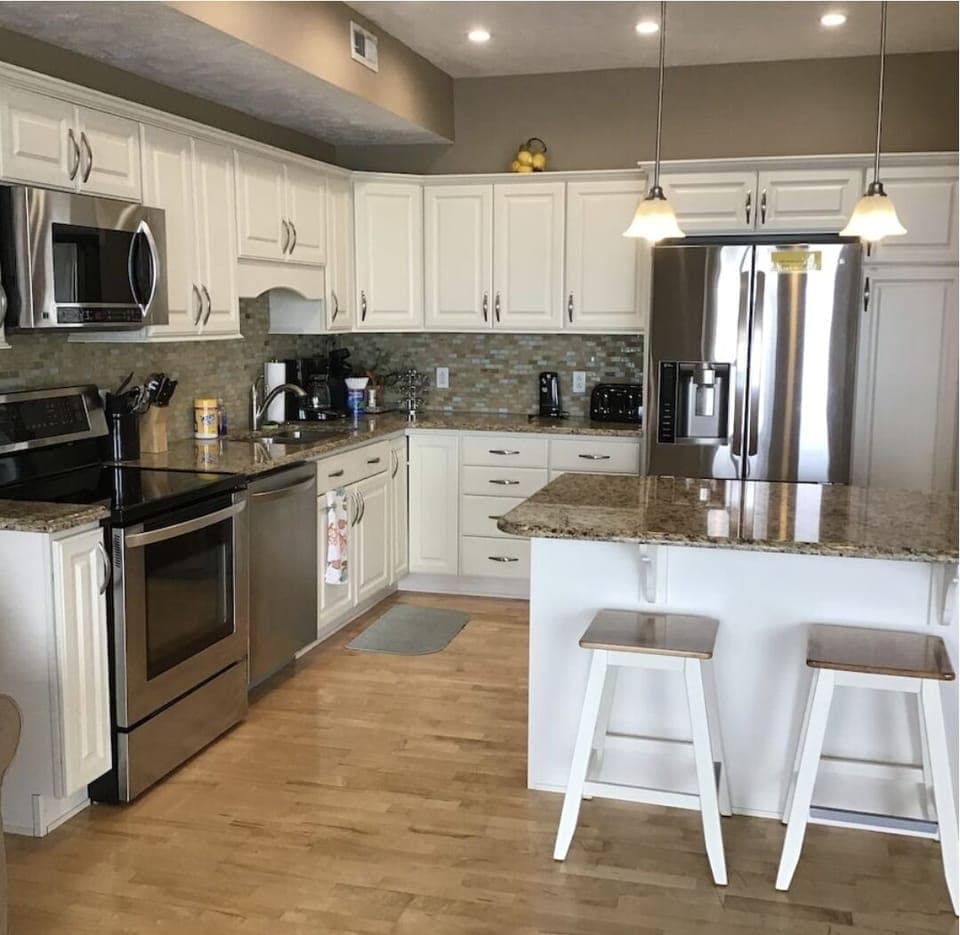 Open concept stainless steel kitchen. 